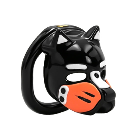 Cage de chasteté Puppy Play en résine noire brillante avec design tête de chien et museau orange.