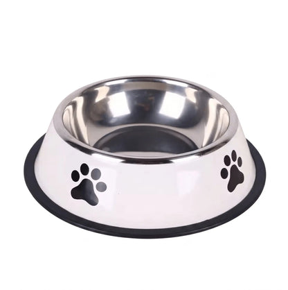 Image d'une gamelle en inox avec des pattes de chien dessus qu'on propose sur le kinkypupshop